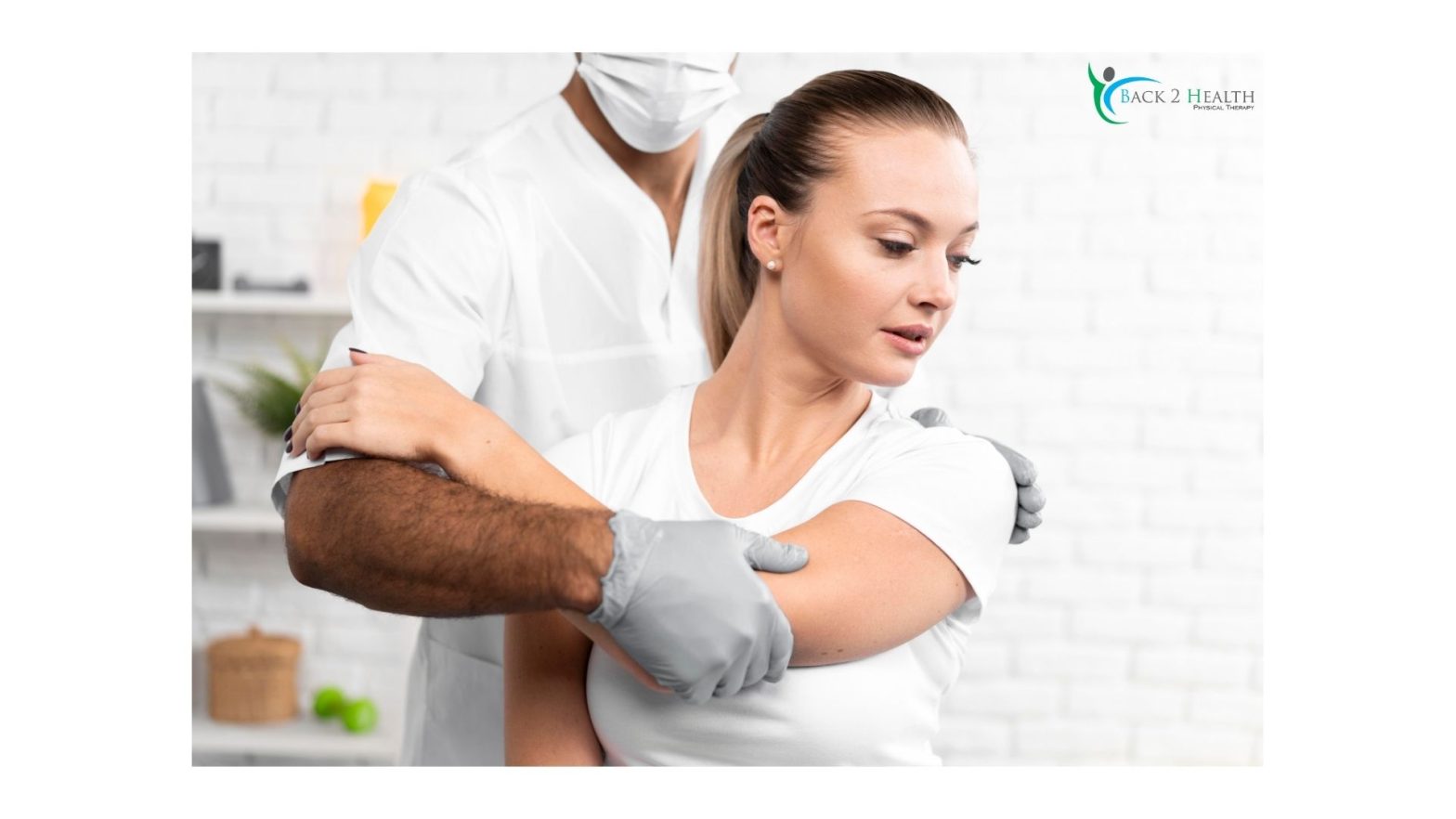 A physical therapist at Back 2 Health performing manual therapy on a woman's shoulder to improve mobility and reduce rehab time for shoulder surgery.