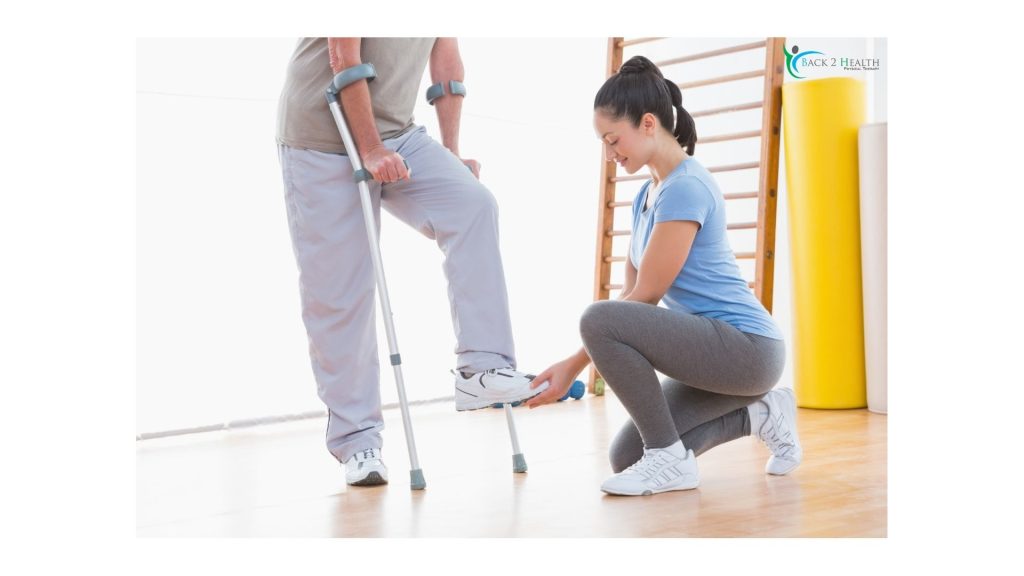 A physical therapist provides hands-on guidance to a patient performing a standing exercise with crutches.