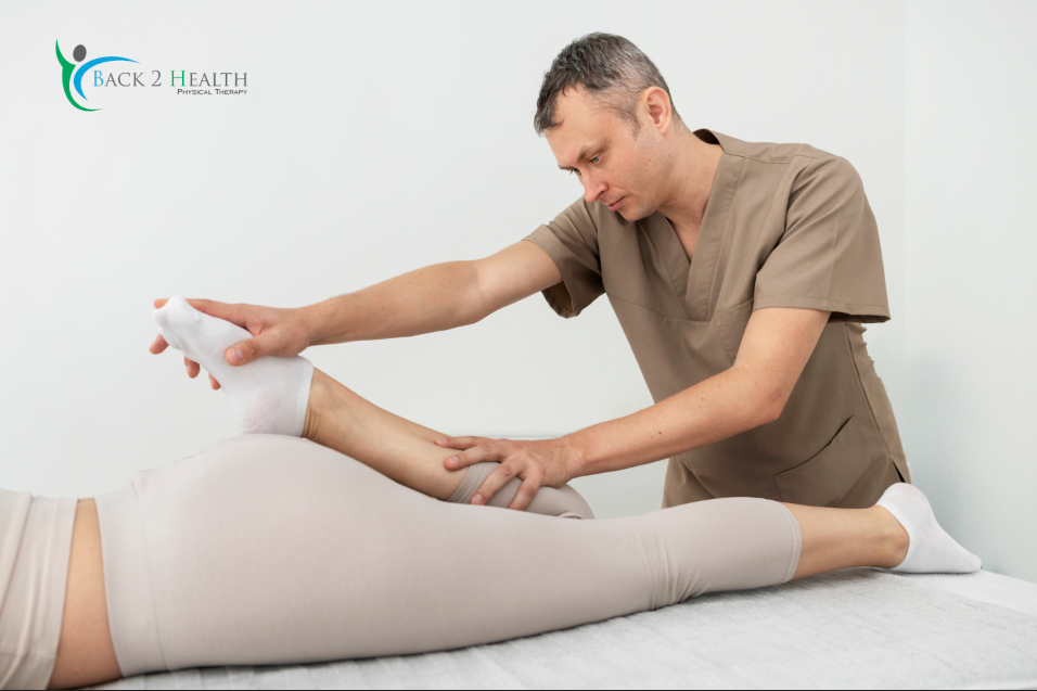 A physical therapist guiding a patient through knee flex and leg mobility exercises at Back 2 Health.