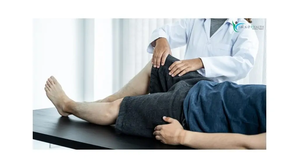 Physical therapist examining a patient’s knee during knee pain physical therapy session at Back 2 Health