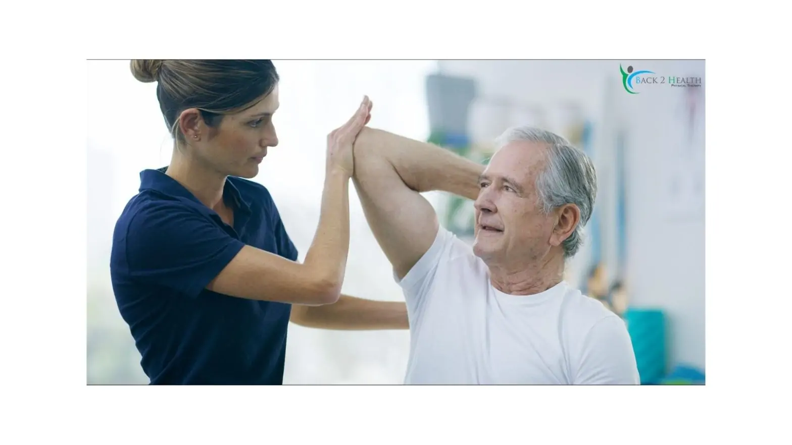 A therapist providing physical therapy for shoulder pain to an elderly patient by assisting with range-of-motion exercises.