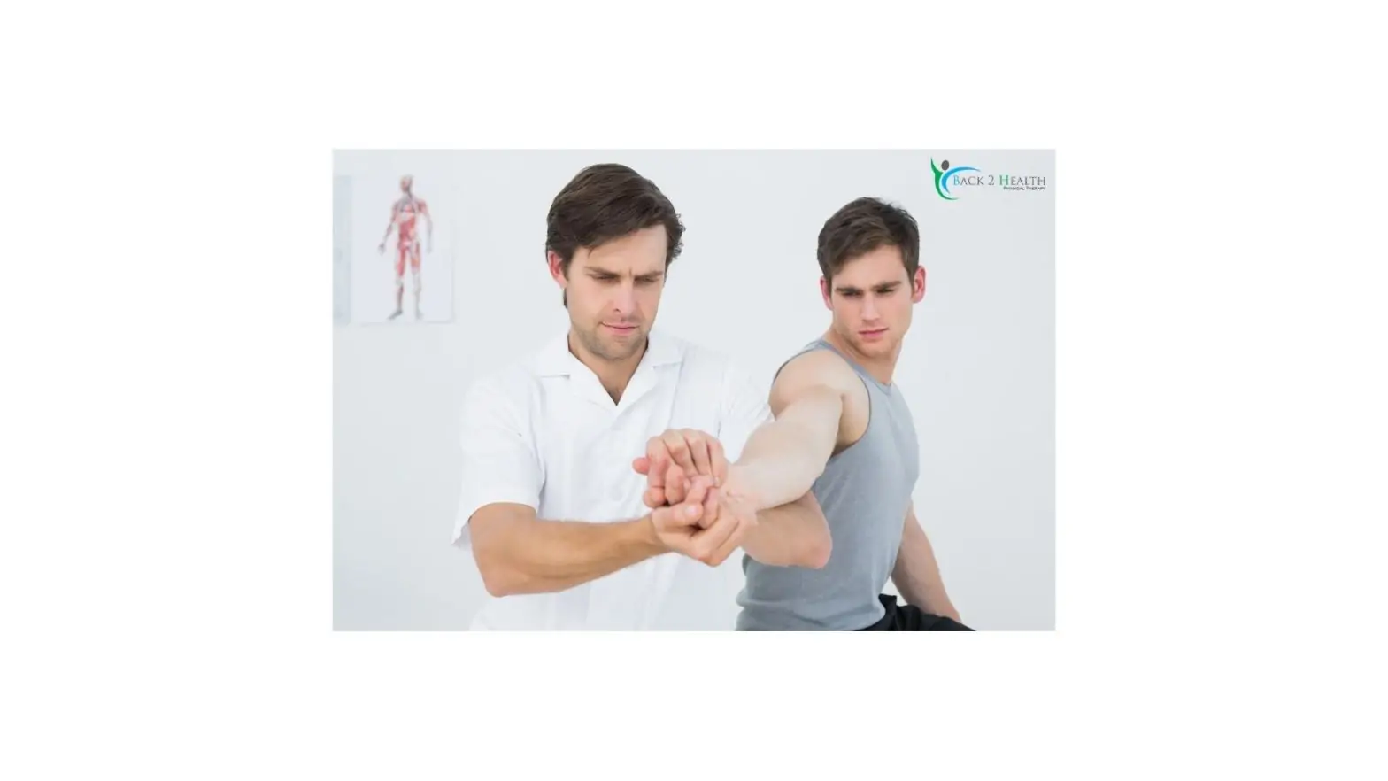 A physical therapist guiding a male patient through a shoulder mobility exercise during a rotator cuff repair protocol rehab session at the Back 2 Health clinic.