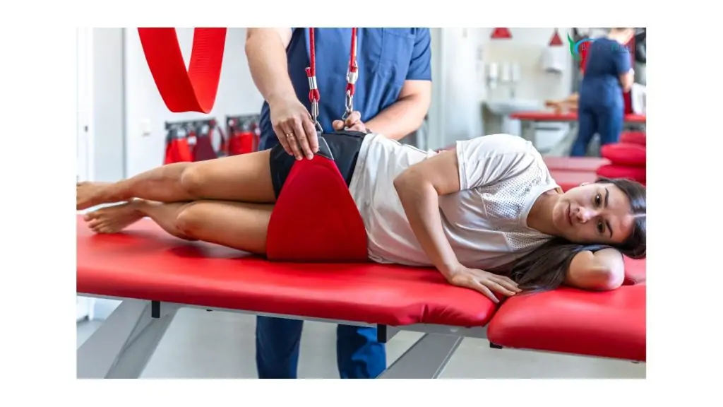 Female patient undergoing sling therapy during auto accident physical therapy at Back 2 Health.